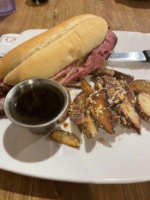 Prime rib sandwich and roasted red potatoes.