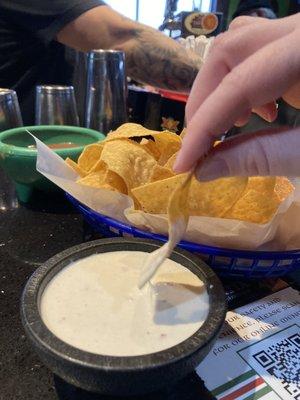 Chips, delicious white sauce  and great house made salsa.