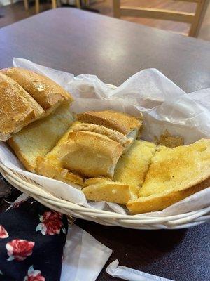 Tender and crisp, freshly smothered garlic bread, a favorite!