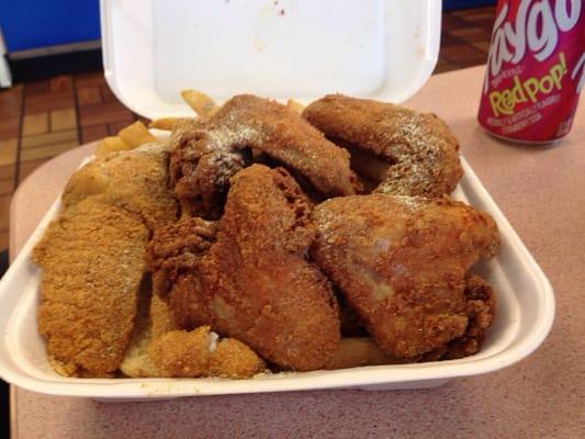 Fried Tilapia and Wing Combo with fries.