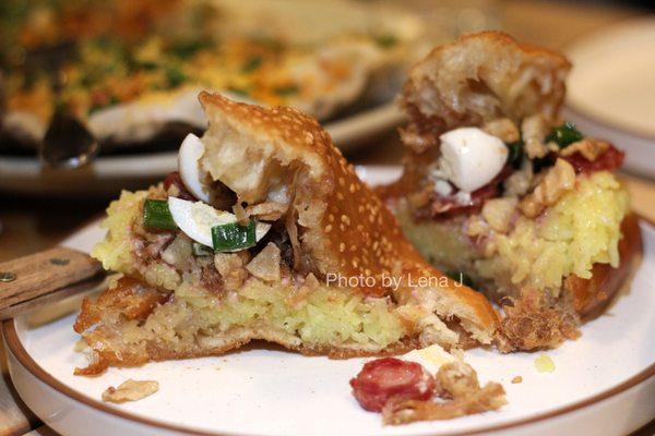 Inside of Bánh Tiêu ($13.95) - savory stuffed Vietnamese donut with sticky rice, sausage, quail egg, pork floss, patê, sc