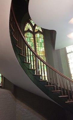 CURVED WOODED STAIRCASE TO ORGAN UP