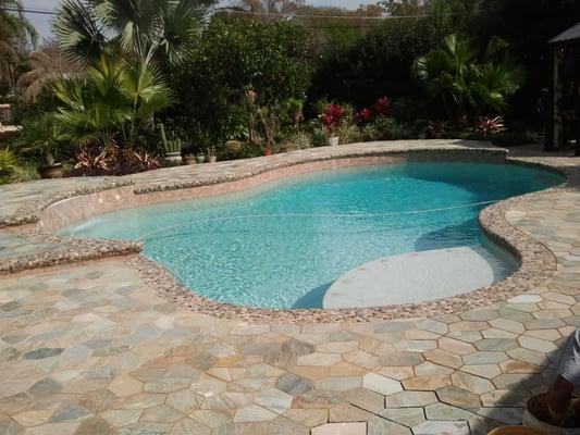 We install both pavers and tile with pool coping