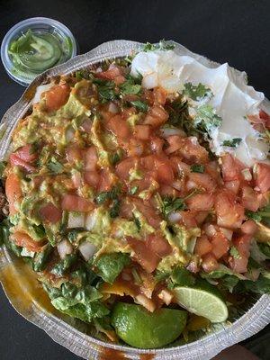 Nachos - pinto beans, carnitas, and everything with a side of jalapeños