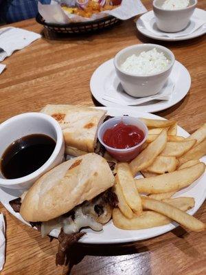 Prime Rib dip with au jus, cole slaw, fries