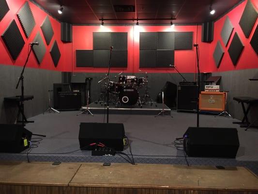 Room E. A mini stage setup with a couch. Mesa Boogie & Orange Dual Terror guitar amps. $26/hr.