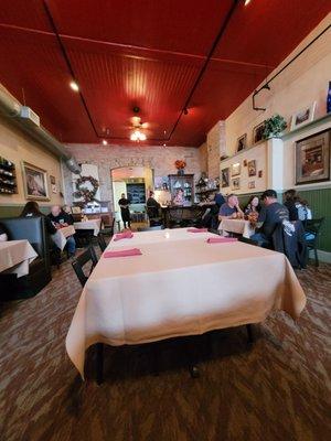 Inside of restaurant. Small bar at the back right.