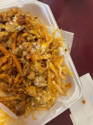 Buffalo Fries with melted shredded cheese, grilled chicken, and tasty sauces.