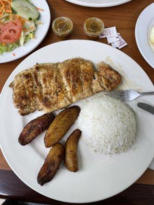 Grilled Chicken Breast comes with three sides (chose salad, rice, and sweet plantains)