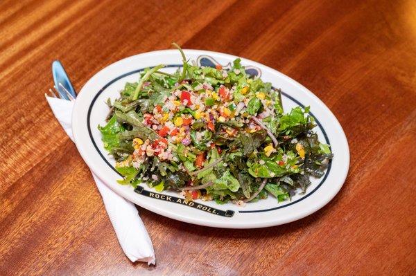 Spicy Kale & Quinoa Salad: Jalapeños, pickled peppers, red onions & corn with lemon cayenne dressing.