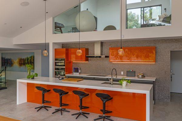 With a silver pebble backsplash and hand-blown glass pendants, the details in this kitchen are just as beautiful as it's color.