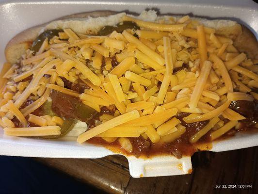 Nathan's hotdog smothered in chili and cheese with mustard and jalapenos!