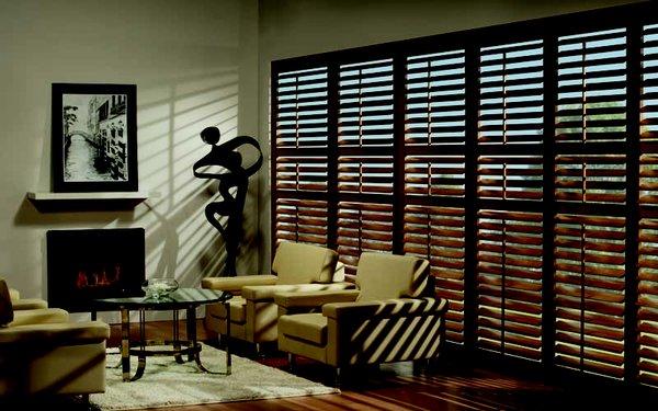 Light oak stain shutters in 3 1/2" louver with center divider rails for light control and privacy.