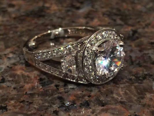 Custom made, white gold, 2 carat round diamond center stone, 2 1/4 carat half moon shape diamonds and 3/4 carat round diamonds pave set!