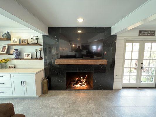 Remodeled fireplace. Built-in and shiplapped wall.