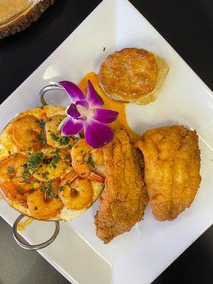 Fried fish with shrimp & grits , served with a biscuit