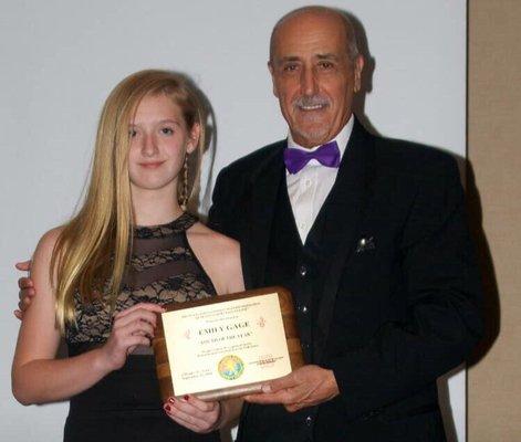 My student Emily winning "Student of the Year" in Chicago presented by GM Pellegrini. Presented only every 5 years!