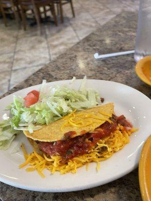 Ground beef taco after I smothered it in salsa!