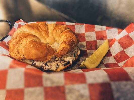 Autumn berry Chicken Salad on toasted Crossiant. Served with your choice of side and a pickle.