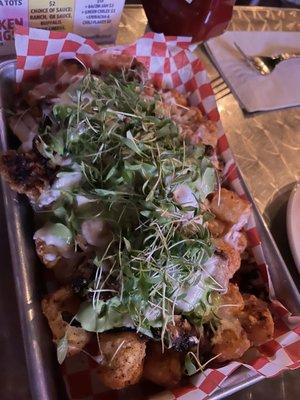 Shawarma tots are DELICIOUS. Crispy tots, cheesy goodness, flavorful chicken and love the micro greens on top.