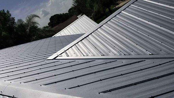 Replaces shingle roof with 5v metal roof