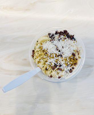 Coconut Sorbet with the Energizer topping (banana, cacao nibs, hemp seed, coconut and bee pollen)