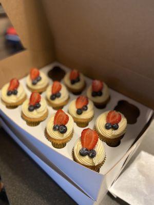 Sugar free vanilla cupcakes with cream cheese frosting and berries added