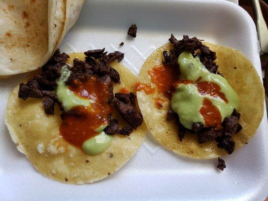 Steak tacos with red, green salsa, cheese quesadilla