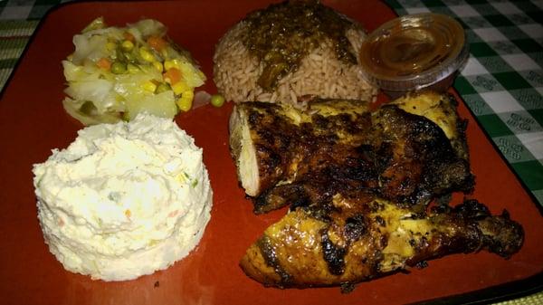 Rice mixed with red beans, jerk chicken, and potato salad. Portions are generous!