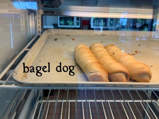 Bagel dog is a hot dog that is wrapped in a bagel dough & freshly baked.