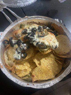 Mexican nachos, aka nachos with only black olives and barely any cheese.