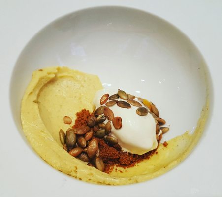 Ingenious pumpkin cheesecake with eggnog gelato and pumpkin seeds/brown sugar sprinkling.  Very beautiful.