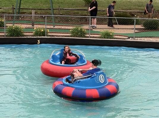 My sister and I riding the bumper boats. This was really fun.