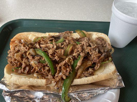 Cheesesteak with peppers, onions, and mushrooms.