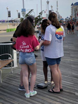 Boardwalk Outreach Praying With People