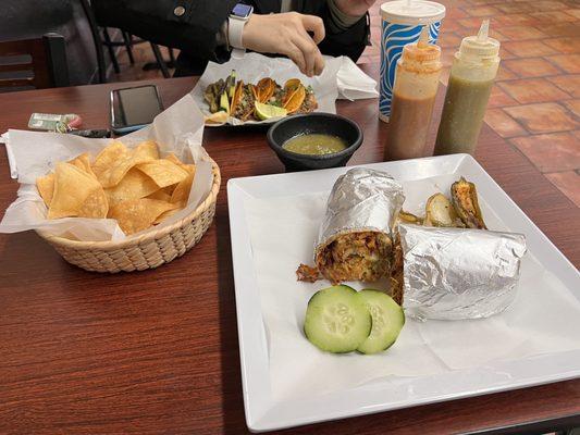 Burrito, chips, salsa, Birria, and Horchata