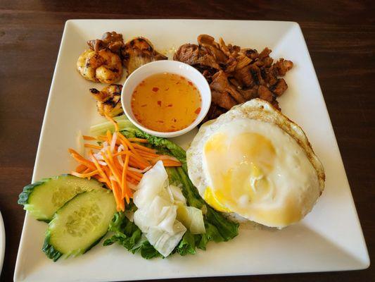 Broken rice with egg, pork and shrimp .