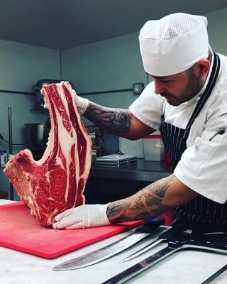 Chef Carlos butchering away!