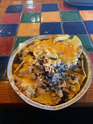 Chicken Nachos with black beans and white queso