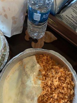 Thin shrimp burrito and rice. Ordered with pinto besns