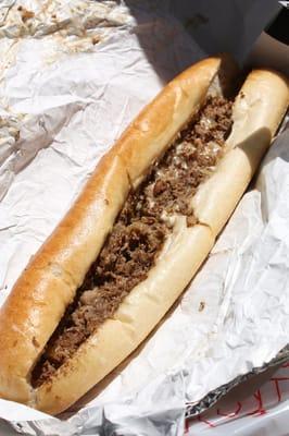 Cheesesteak, fried onions, American cheese.