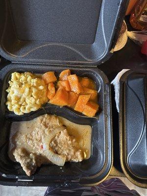 Smothered pork chops, Mac and cheese & sweet potatoes.