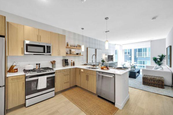 Wide-angle view of modern kitchen layout.