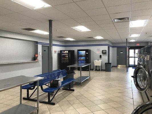 Benches, folding table, vending machine for soda & snacks.