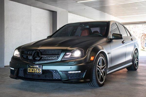 C63 Full wrap in KPMF Dark Sage, Ceramic coated, lights tinted, Satin black chrome delete, aftermarket spoiler & diffuser install