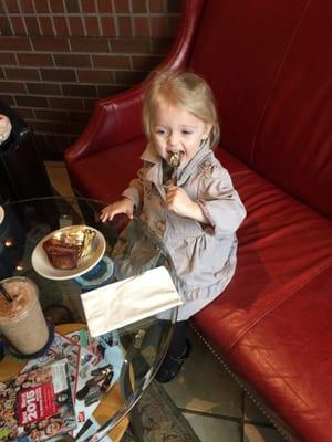 My little girl Amelia eating a cinnamon roll!