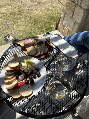 Wine Tasting with Brie and fruit plate and a charcuterie board.