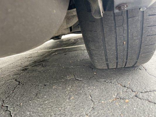 Passenger rear tire showing uneven wear from not aligning the tire to vehicle specs