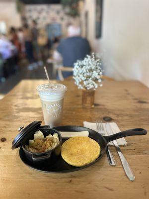 scrambled egg with hogao and an arepa; amaretto iced latte with oat milk