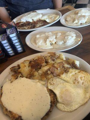 Country fried steak with gravy and biscuits